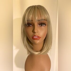 HAIR -WIG- Ambre dark natural blonde to light natural blonde. 12 in. Long bob